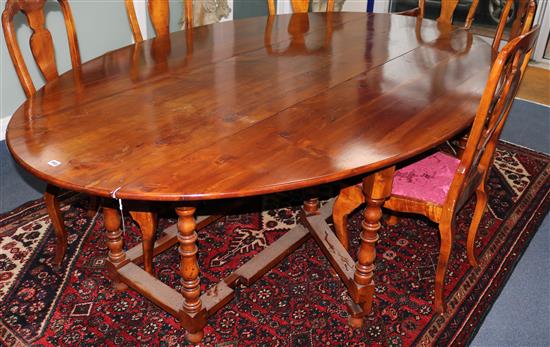 An early 18th century style cherrywood drop leaf double gateleg table, Extends to 246 x 152cm